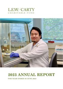 Cover page of the 2023 LEW Carty Annual Report with a male scientist typing and looking at the camera